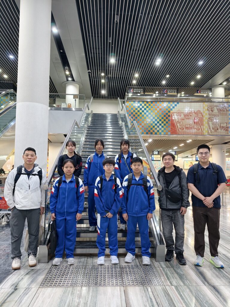 The team at the airport on the way to Beijing