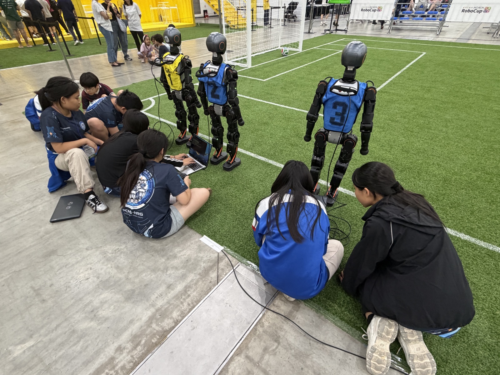Pitch-side adjustments before a Humanoid Soccer match