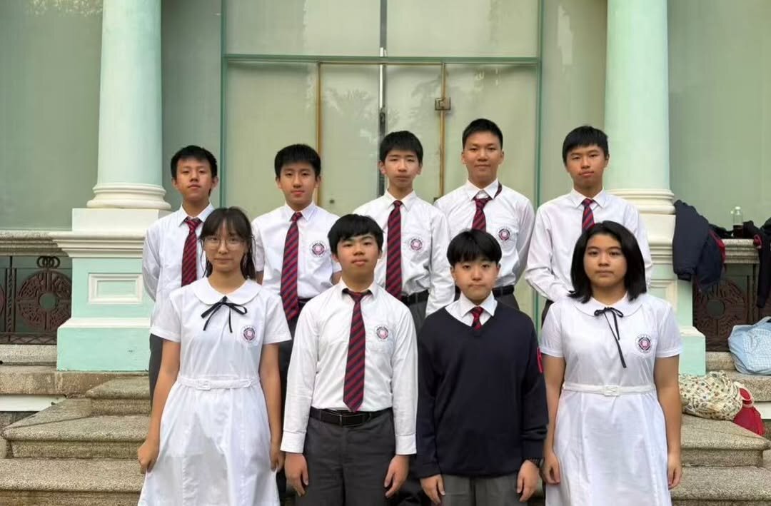 Team members in school uniform photographed together