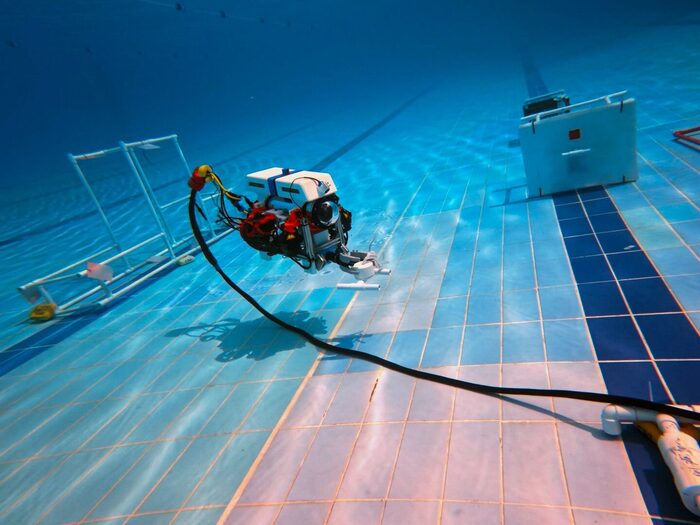 The Mosasaurus ROV working a mission structure on the bottom of the competition pool