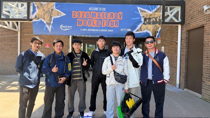 Team members at the MATE ROV World Championship venue entrance