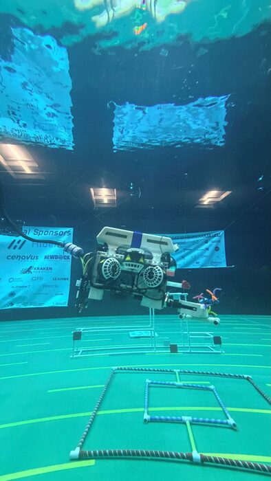 The Mosasaurus ROV flying over a mission structure underwater