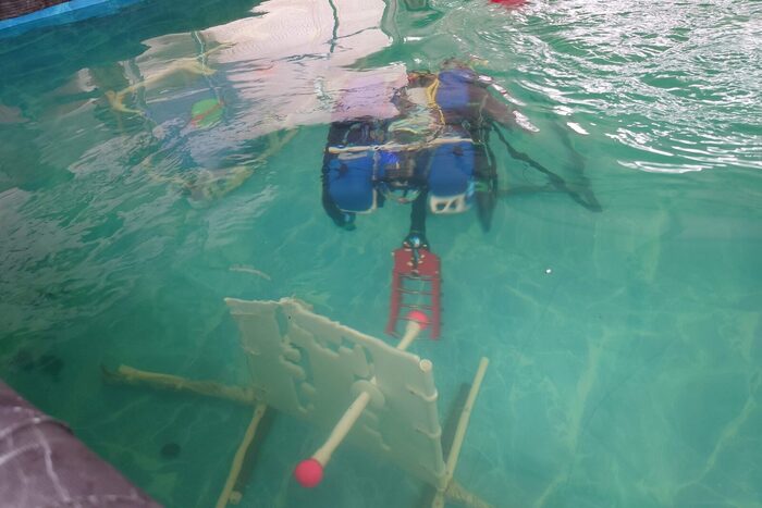 The water-operations ROV working on a submerged task structure