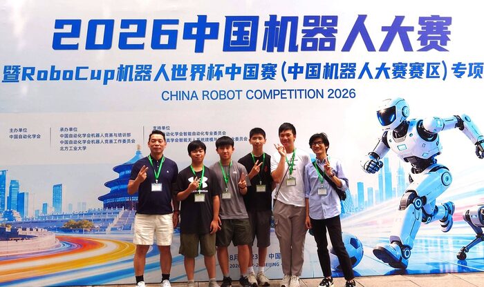 The team in front of the 2026 China Robot Competition backdrop in Beijing